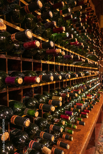 Fotografie Wine cellar rack of empty bottles