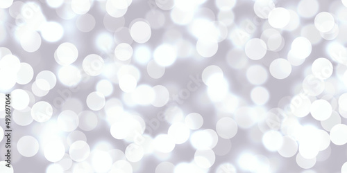 Seamless iridescent bokeh texture. Silver and white dreamy soft focus holiday party backdrop. Abstract blurred glitter circles 3D render wallpaper.