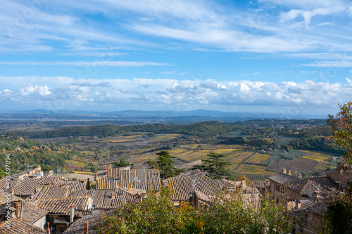 View on old roofs, hills and vineyards from old town Montepulciano, Tuscany, Italy