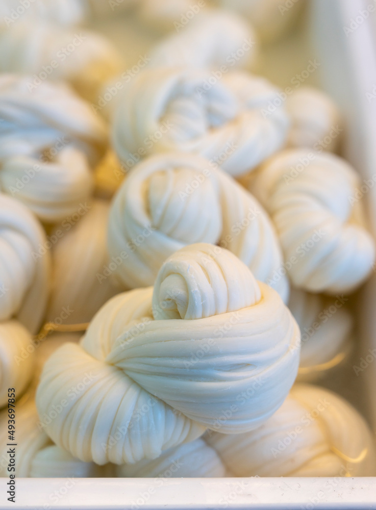White soft braid cheese on market display White soft braid cheese on market display