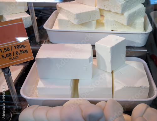 Photography White soft salted feta cheeses on market display