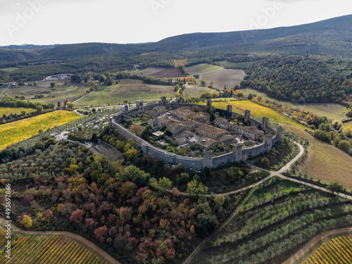 Aeriel view on medieval fortress town on hilltop Monteriggione in Tuscany, Italy photo