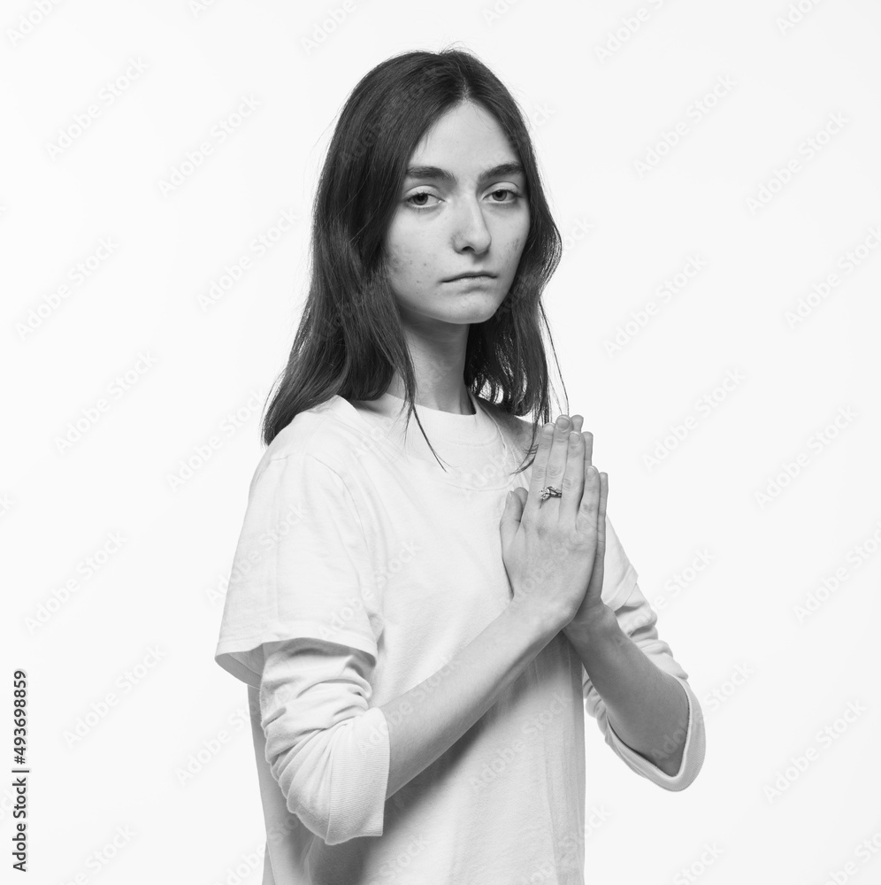 black and white portrait of a young Ukrainian girl praying for peace and victory black and white portrait of a young Ukrainian girl praying for peace and victory