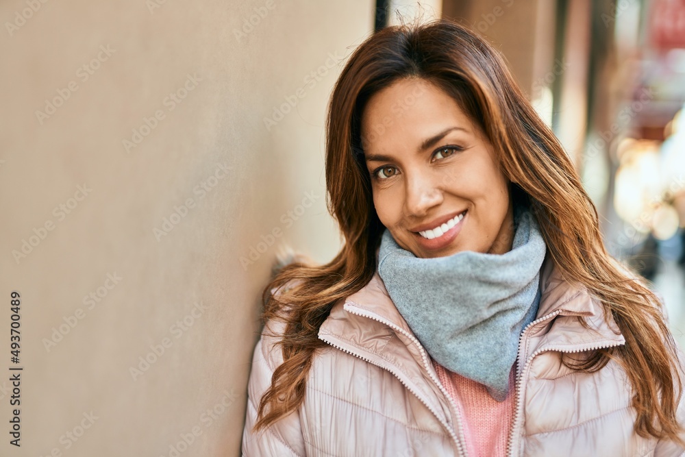 Young hispanic woman smiling happy standing at the city. Young hispanic woman smiling happy standing at the city.