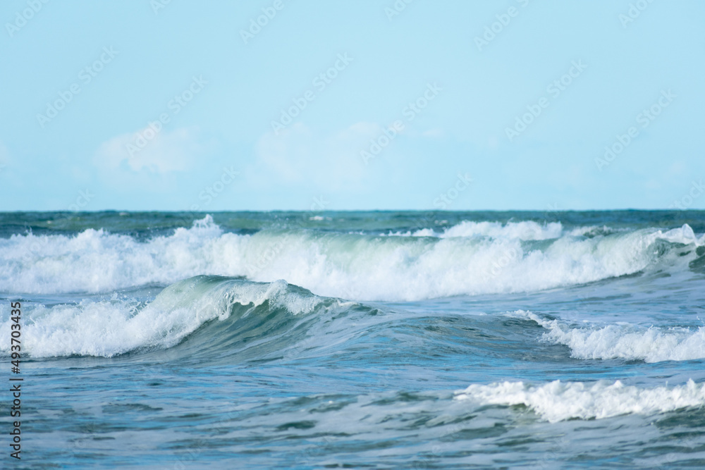 Crashing ocean waves horizon with a blue sky, Blue background, Ocean scene