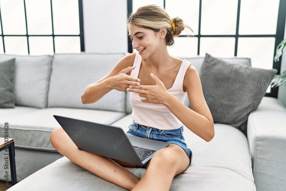 Young caucasian woman having video call communicating with deaf language at home Young caucasian woman having video call communicating with deaf language at home