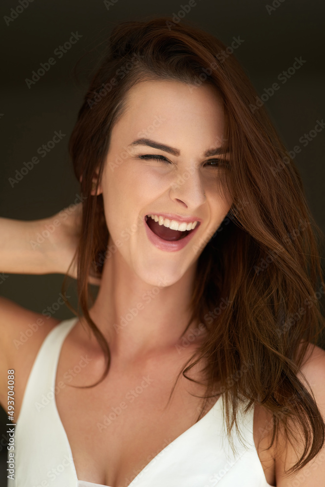 Do you like what you see. Studio portrait of an attractive young woman winking against a black background. Do you like what you see. Studio portrait of an attractive young woman winking against a black background.