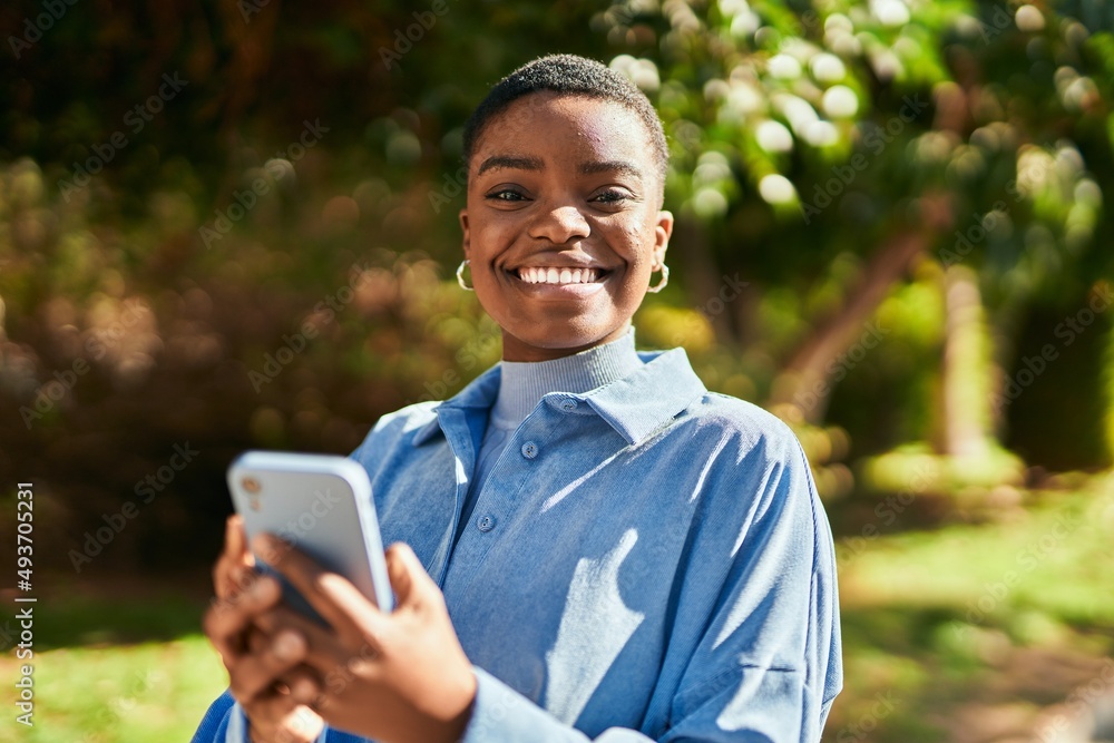 Young african american woman smiling happy using smartphone at the city Young african american woman smiling happy using smartphone at the city