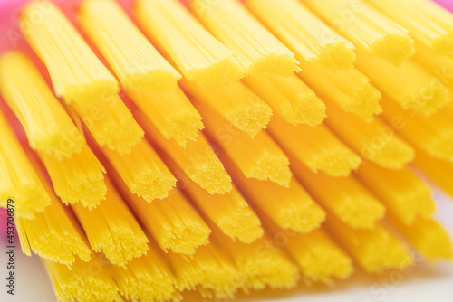 Foto toothbrush with pink handle yellow brush head