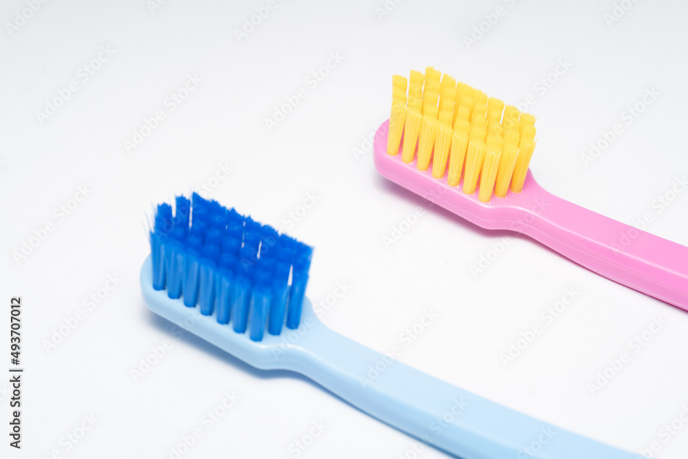 A conceptual of a couple toothbrush in love. Toothbrushes convey the human relationship between a man and a woman. A conceptual of a couple toothbrush in love. Toothbrushes convey the human relationship between a man and a woman.