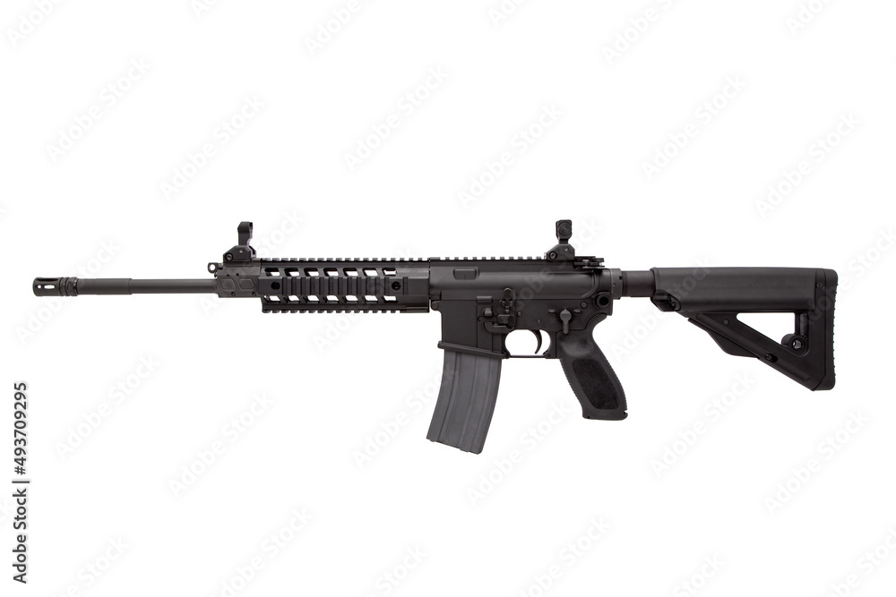 Modern automatic rifle isolated on black background. Weapons for police, special forces and the army. A carbine with optical, mechanical sights and a silencer on a dark back