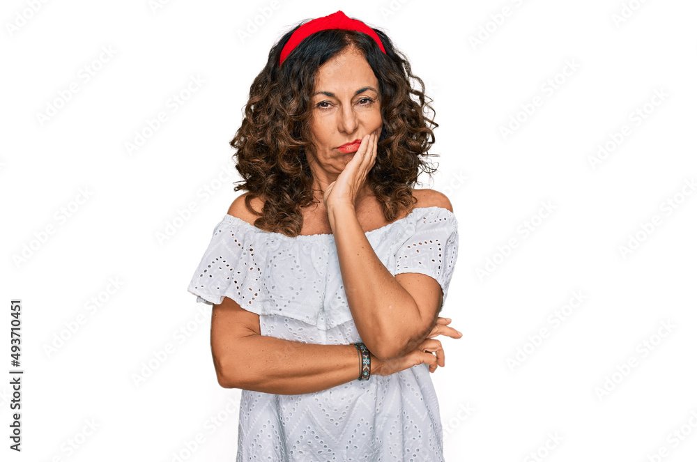Middle age hispanic woman wearing casual clothes thinking looking tired and bored with depression problems with crossed arms. Middle age hispanic woman wearing casual clothes thinking looking tired and bored with depression problems with crossed arms.