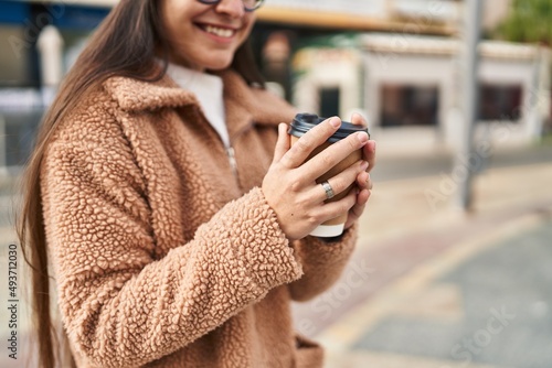 Wallpaper Mural Young hispanic woman smiling confident drinking coffee at street Torontodigital.ca
