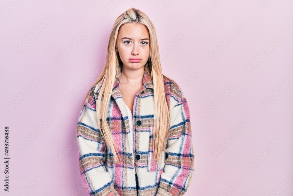 Young blonde girl wearing casual clothes depressed and worry for distress, crying angry and afraid. sad expression. Young blonde girl wearing casual clothes depressed and worry for distress, crying angry and afraid. sad expression.