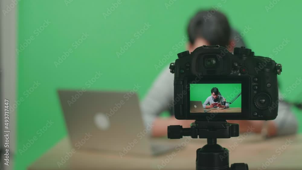 Close Up Of A Camera Monitor Recording Asian Man Gamer With Headphone And Computer Losing Mobile Phone Game On The Green Screen Background
Close Up Of A Camera Monitor Recording Asian Man Gamer With Headphone And Computer Losing Mobile Phone Game On The Green Screen Background