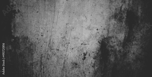 Black concrete wall or dark gray rough grainy stone texture background. © Background Studio