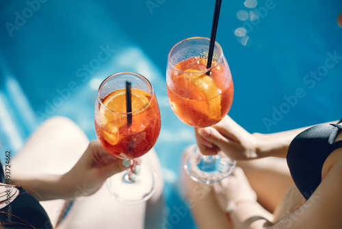 Cropped photo of a two coctails in girls' hands