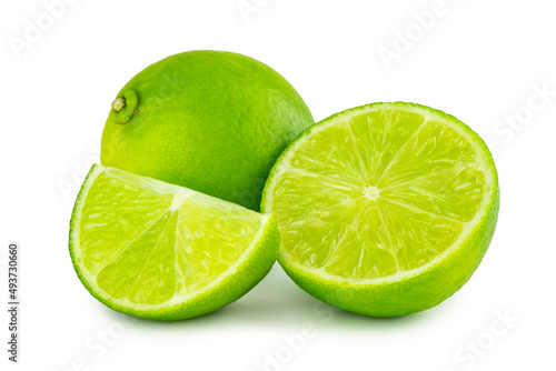 Lime citrus, seedless lime, fruits in whole and cut crosswise in half and wedge isolated on white background, cutout.