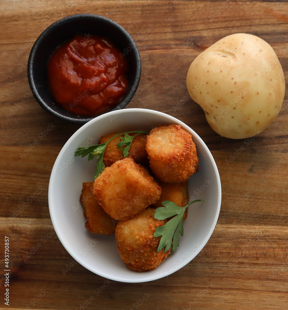 Various appetizers including potato tots, crumbed chicken nuggets and bitterballen. Various appetizers including potato tots, crumbed chicken nuggets and bitterballen.