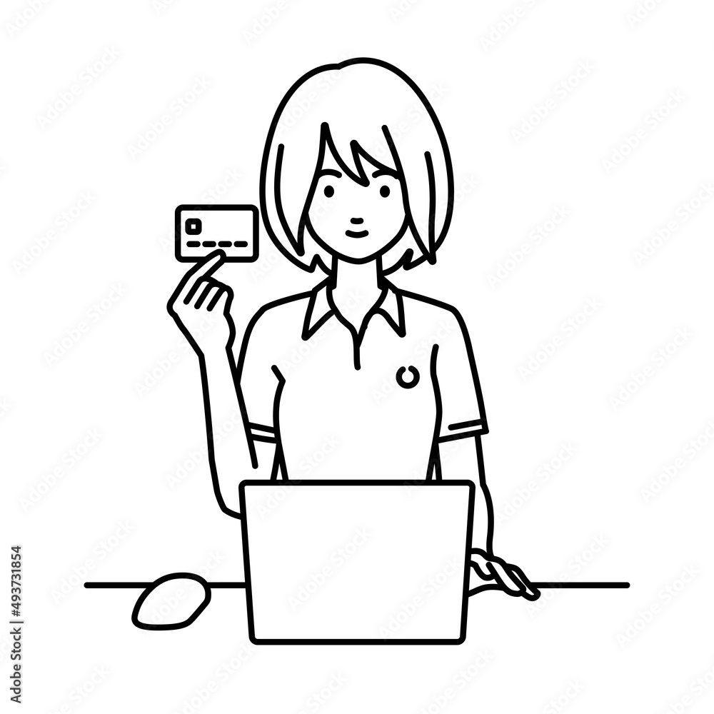 デスクで座ってPCを使いながらクレジットカードを手に持っているポロシャツの女性