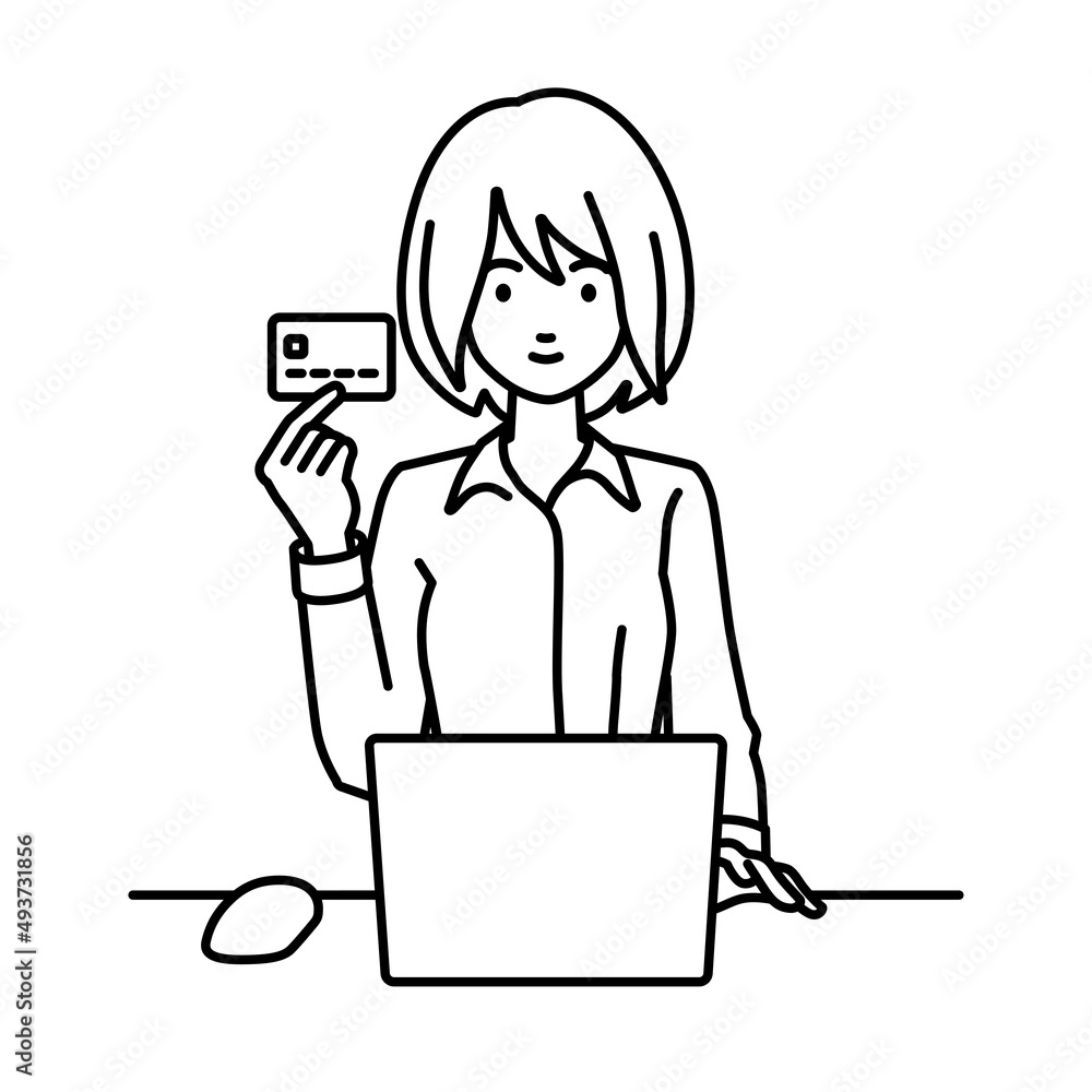 デスクで座ってPCを使いながらクレジットカードを手に持っているブラウスの女性
