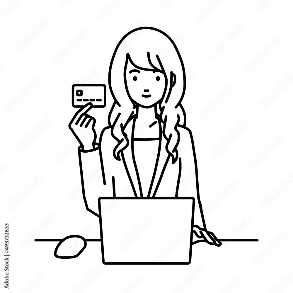 デスクで座ってPCを使いながらクレジットカードを手に持っているスーツの女性