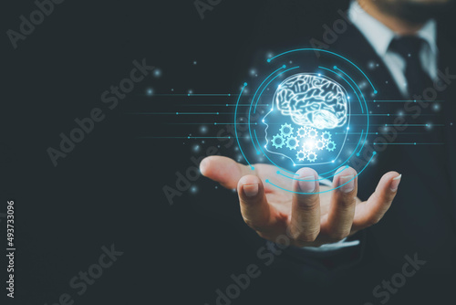 Brain inside the hands of the businessman. Artificial Intelligence concept, Technology, concept.