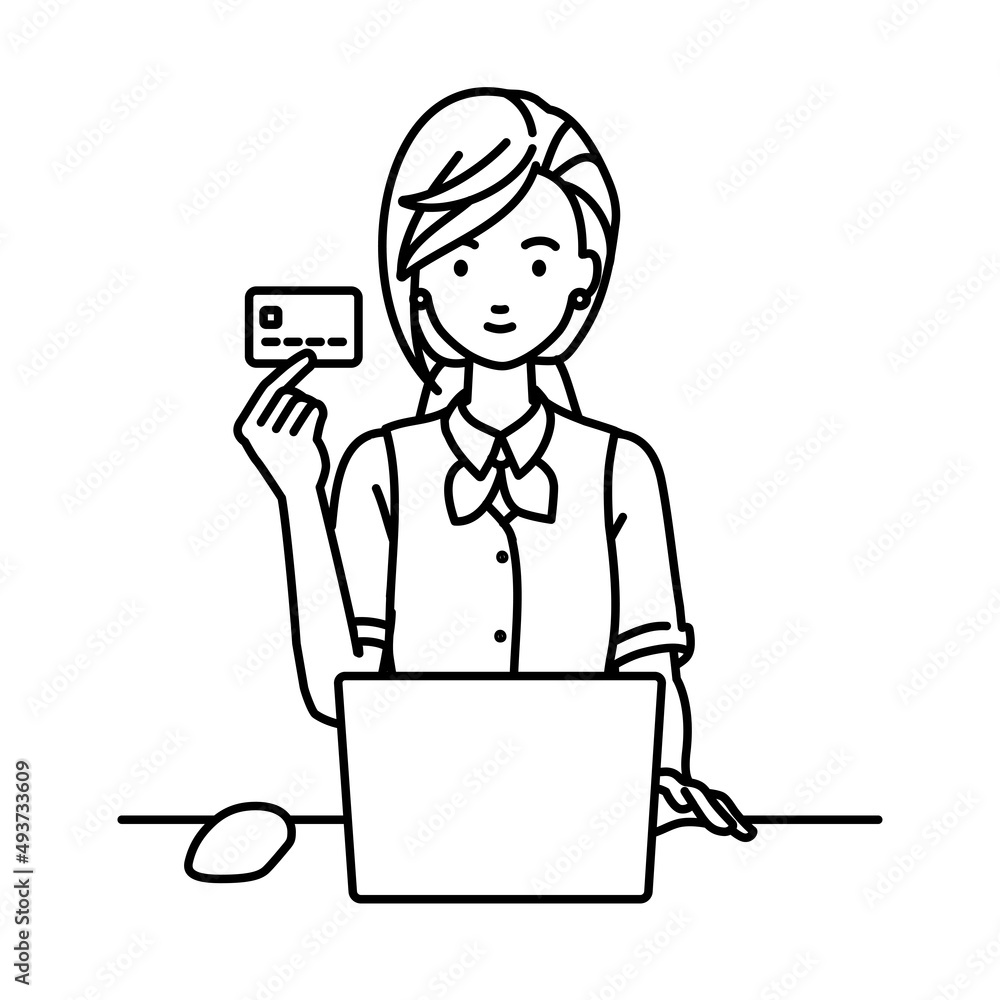 デスクで座ってPCを使いながらクレジットカードを手に持っている事務員制服の女性