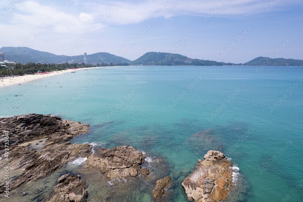 Aerial view of blue sea surface water texture background Drone view over sea Waves water surface texture on sunny tropical ocean in Phuket island Thailand.Travel and tour background