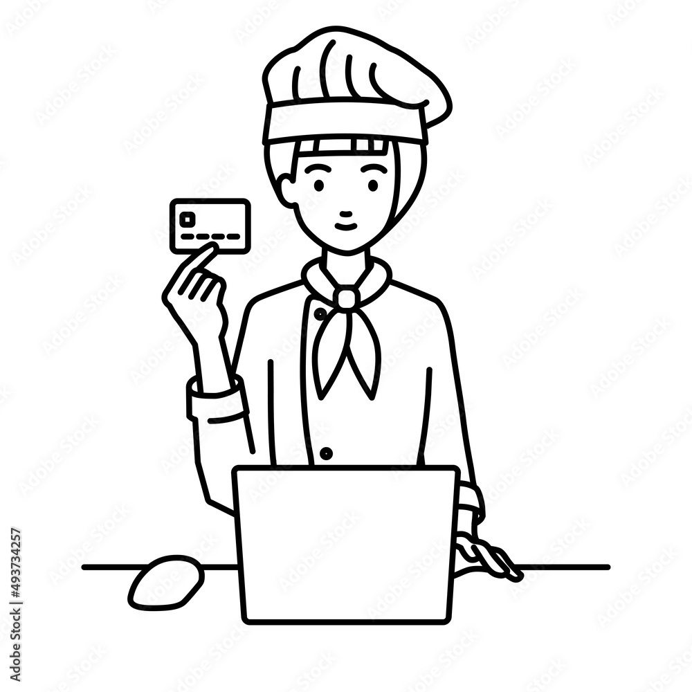 デスクで座ってPCを使いながらクレジットカードを手に持っている調理師の女性