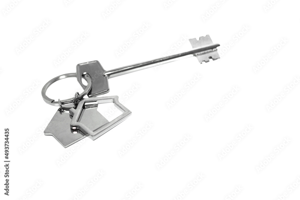 House key with a house shaped keychain, isolated on white background House key with a house shaped keychain, isolated on white background