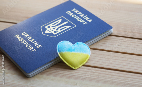 Biometric passport of a citizen of Ukraine. Migration, refugee status, travel concept, Stop war, peace. copy space photo