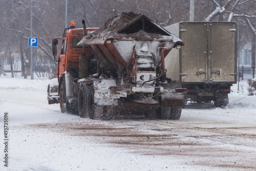 Uralsk, Kazakhstan (Qazaqstan), 12.03.2022 - Machine for sanding roads, sanding roads with a mixture of sand and salt, combating winter slipperiness on roads
