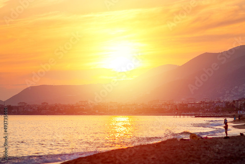 Beautiful sunset over the mountains and the sea  sun glare. The concept of vacation  atmosphere  travel  vacation.