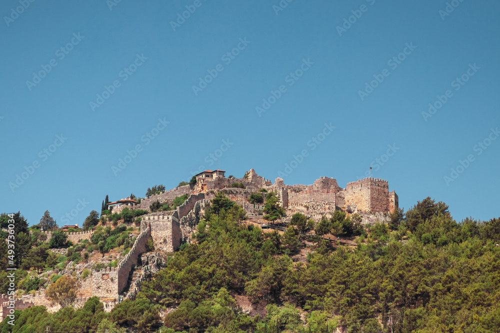 Castle fortress on top of a mountain, ancient buildings, fortifications.
