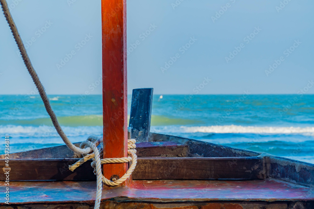 An old fishing boat at sea with copy space for text. An old fishing boat at sea with copy space for text.