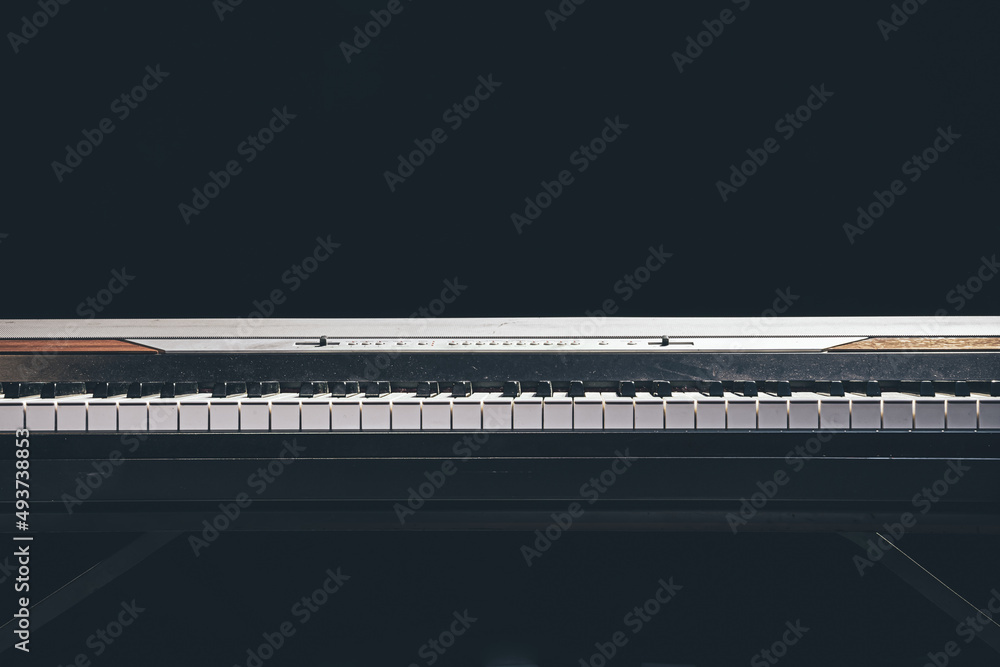 Piano keys isolated in the dark, copy space. Piano keys isolated in the dark, copy space.
