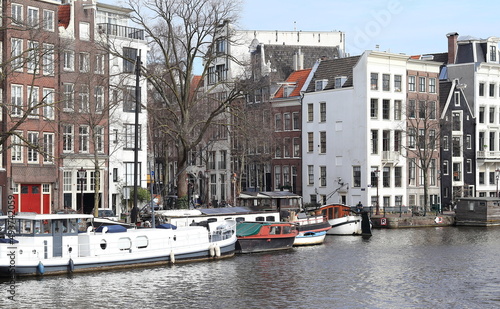 Amsterdam Amstel River View with Traditional Architecture and Boats, Netherlands