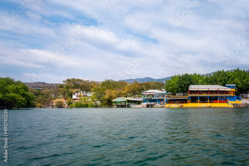 View of Tuxtla Gutierrez City port from the water on a boat tour of Sumidero Canyon, Chiapas, Yucatan, Mexico. Sumidero Canyon, a deep natural canyon and a popular tourist destination in south Mexico. photo