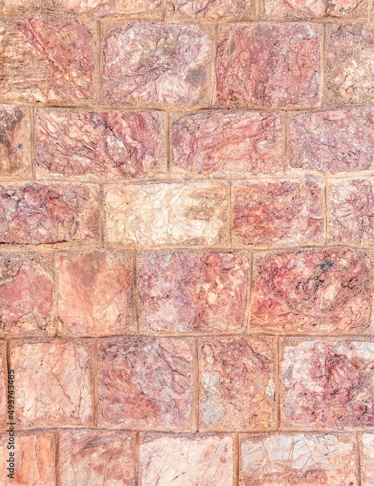 Obraz premium reddish brown stone wall closeup, seamless pattern background