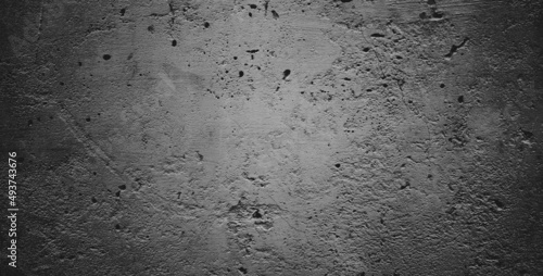 Black grainy stone texture backgroundor dark gray textured background.