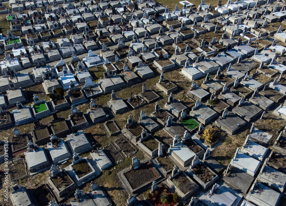 the graves in a cemetery seen from above