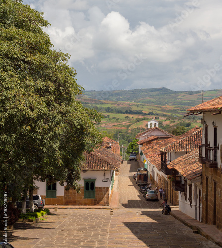 Typical street of Barichara, Colombia, with the Andes Mountains in the background.