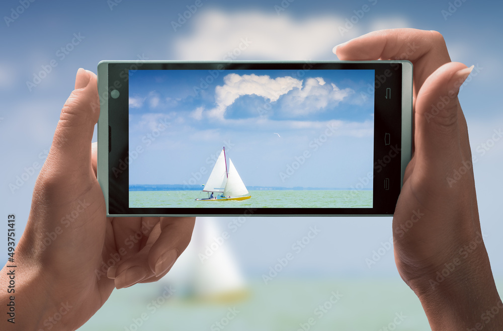 Sailing boat in open sea on a smartphone