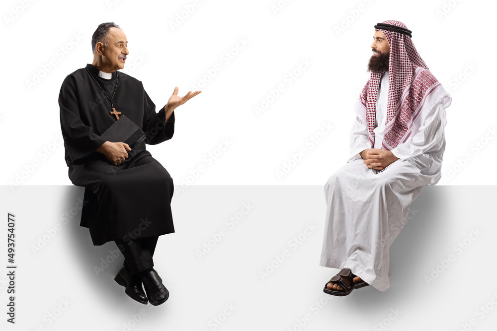 Priest talking to a saudi arab man and sitting on a blank panel Priest talking to a saudi arab man and sitting on a blank panel
