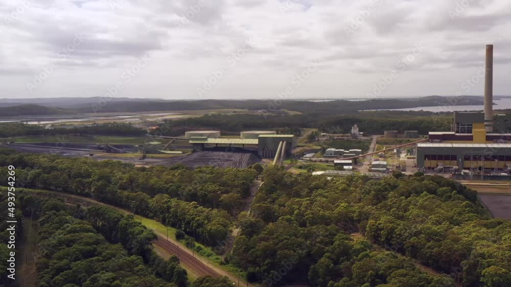 Coal storage at Eraring power plant and generation station on lake as 4k.
