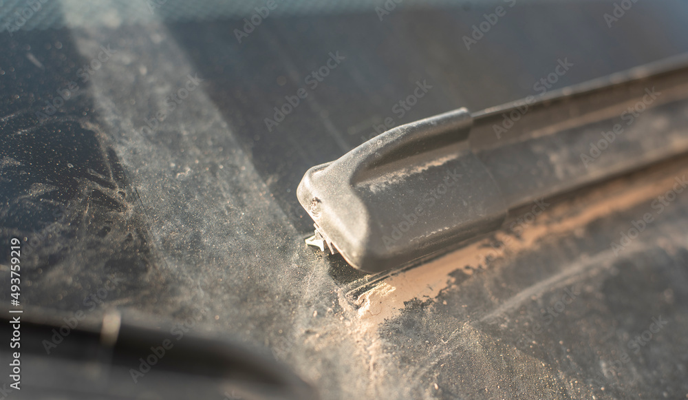 sahara sand at the windshield wiper of a car sahara sand at the windshield wiper of a car