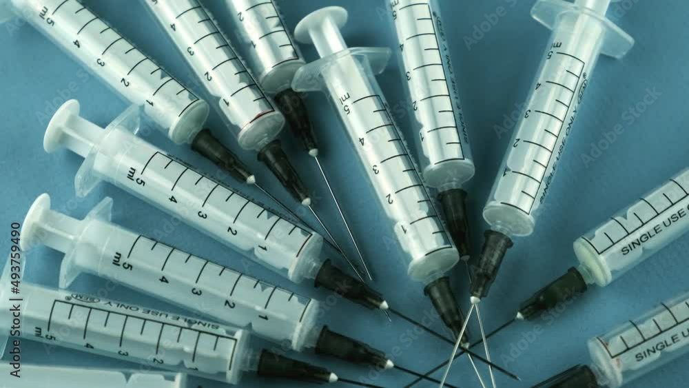 Syringes for injection, syringes for injection, slowly rotating in a ...