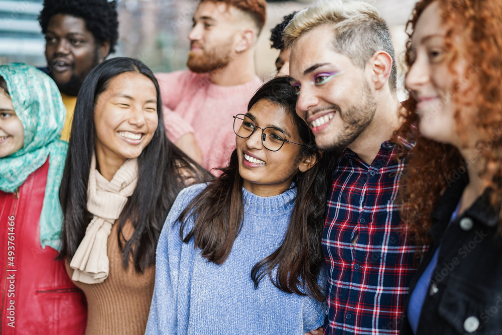 Young diverse people having fun outdoor laughing together - Diversity concept - Focus on indian girl face