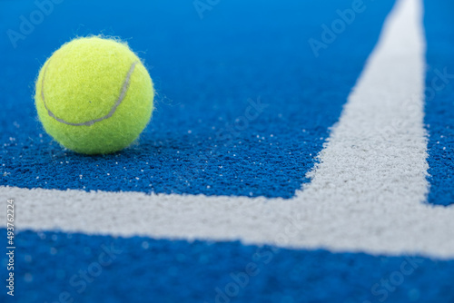 Selective focus.Bright blue tennis, paddle ball or pickleball court close up of service line outdoors. © Vic